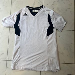 White and navy blue adidas golf shirt.
